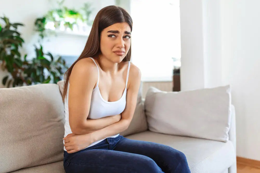 Girl holding her stomach 